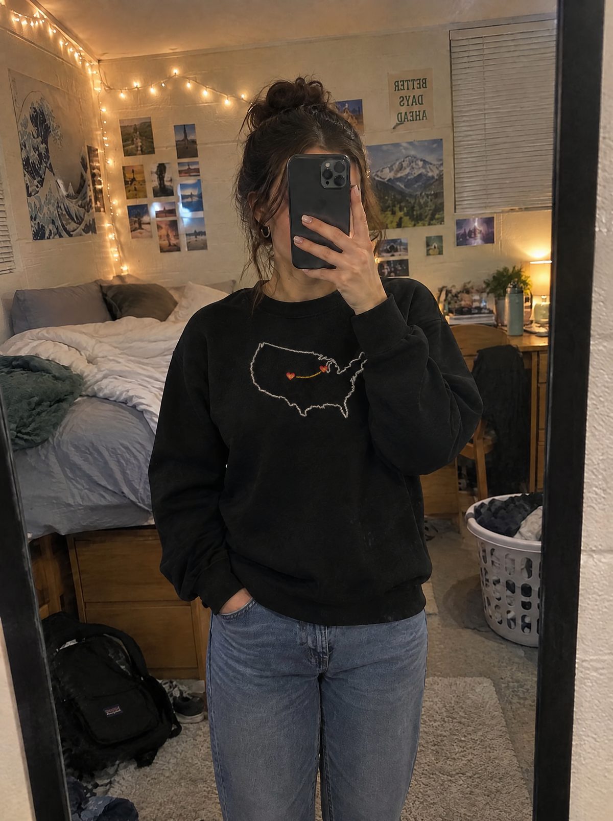 A mirror selfie in a dorm room, wearing the sweatshirt